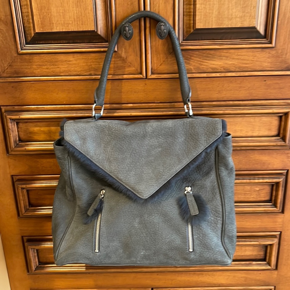 Romygold purse green suede leather with real fur. Good condition